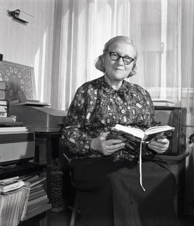 Rózsa Péter sitting on a chair reading a book (date unknown)